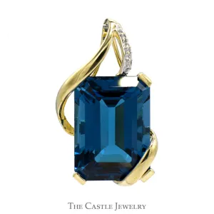 Emerald Cut Blue Topaz Pendant with Diamond Accents in 10k Yellow Gold Open Swirled Setting